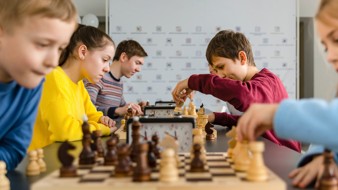 Kids playing in a chess tournament